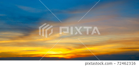 Beautiful sunset sky above clouds with dramatic light. Wide photo. Beautiful sunset sky above clouds with dramatic light. Wide photo. 72462316