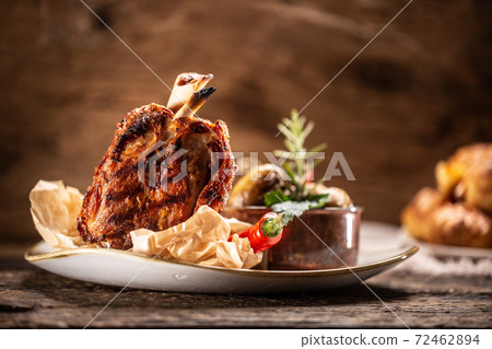German pork ham hock or Schweinshaxe served in a rustic restaurant 72462894