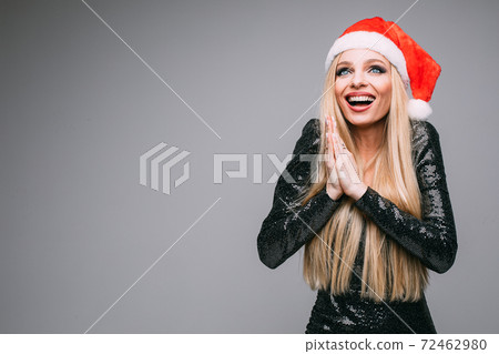 handsome young blonde woman rejoices in christmas 72462980