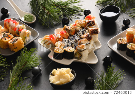 Festive Christmas dinner with sushi set  72463013
