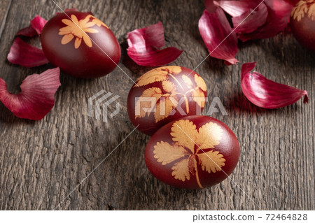 Easter eggs dyed with onion peels on a table, close up Easter eggs dyed with onion peels on a table, close up 72464828