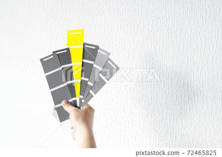 Yellow and gray swatches in hand Yellow and gray swatches in hand 72465825