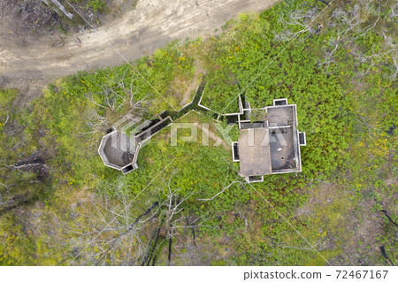 Aerial photograph of structural ruins and forest after bushfires in regional Australia 72467167