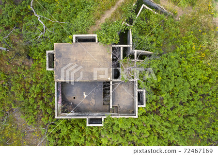 Aerial photograph of structural ruins and forest after bushfires in regional Australia 72467169