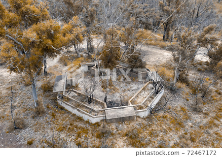 Aerial photograph of structural ruins and forest after bushfires in regional Australia 72467172