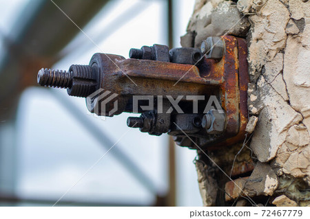Industrial fastening in a concrete wall with a large bolt 72467779