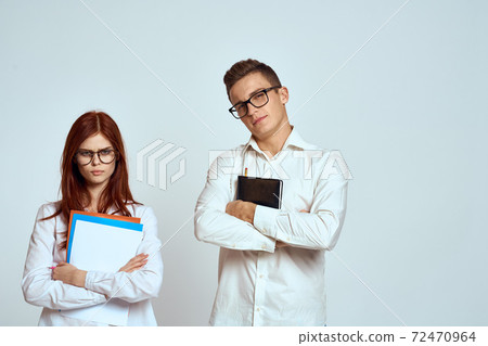 business man and woman secretary documents employees colleagues on light background cropped view business man and woman secretary documents employees colleagues on light background cropped view 72470964