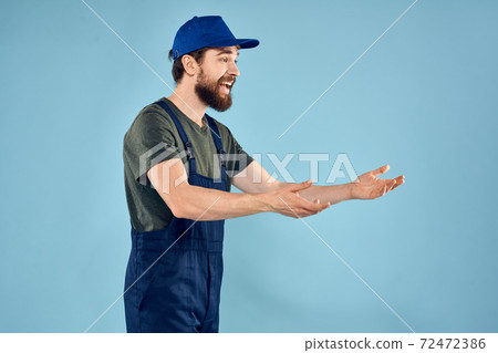 Man in working uniform emotions in life delivery service work Man in working uniform emotions in life delivery service work 72472386