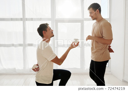 Loving man proposing to beloved partner 72474219