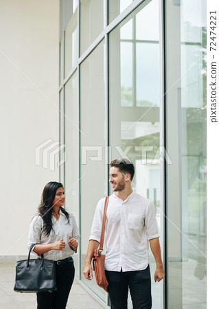 Multi-ethnic business couple Multi-ethnic business couple 72474221