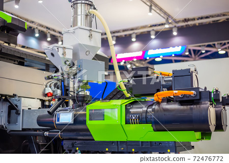 Automatic plastic injection molding machine during work at exhibition 72476772