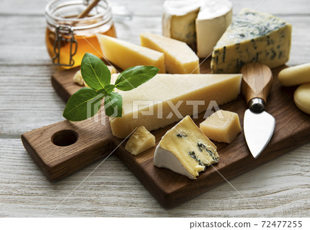 Various types of cheese  on a white wooden  background 72477255