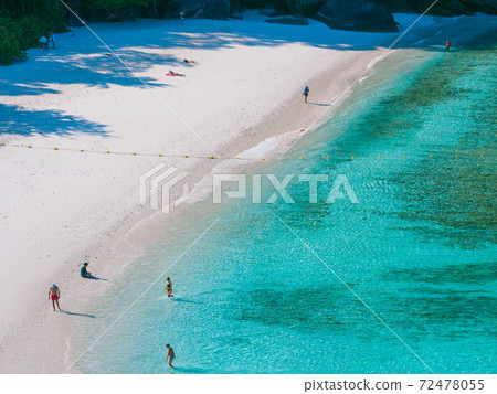 People enjoying the clear waters on the beach (Donald Duck Bay, Similan Islands, Kingdom of Thailand) 72478055