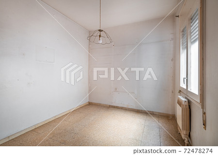 Empty, old and dirty room with white walls and traces of shelves 72478274