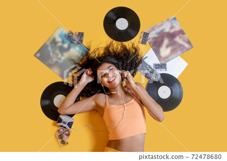 Sweet young girl listening to music and enjoying Sweet young girl listening to music and enjoying 72478680