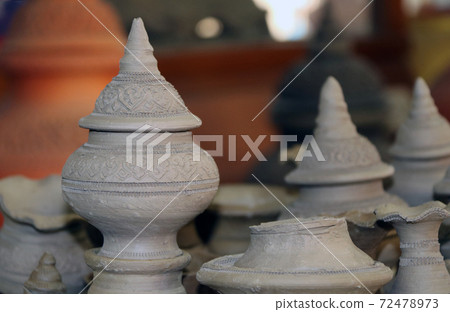 Small raw pottery before burn in the kiln, at Kret Island in Nonthaburi Thailand. 72478973