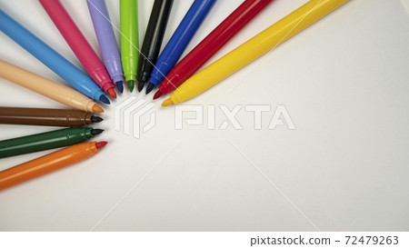 Different colors of markers on white background. 72479263