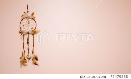 Dream catcher on a pink wall 72479288