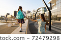 Young mother with little daughter in uniform going to school at morning 72479298
