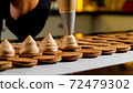 Chef is making caramel macarons, close-up. 72479302