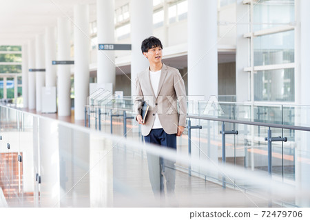 Young businessman in the office Young businessman in the office 72479706