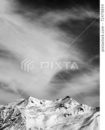 Black and white winter snowy mountains at windy day Black and white winter snowy mountains at windy day 72479854