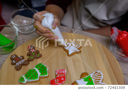 Homemade Xmas cookie for Christmas and Happy New Year. Cooking gingerbread with friend and Family on winter holiday at home. 72481309