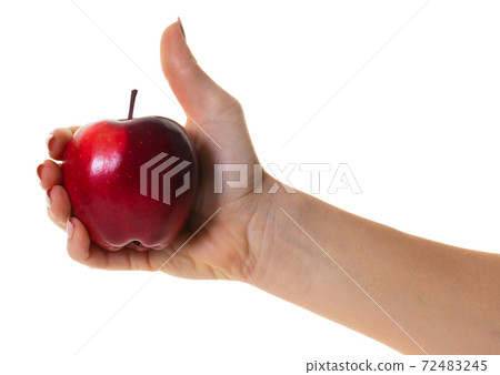 red apple in hand red apple in hand 72483245