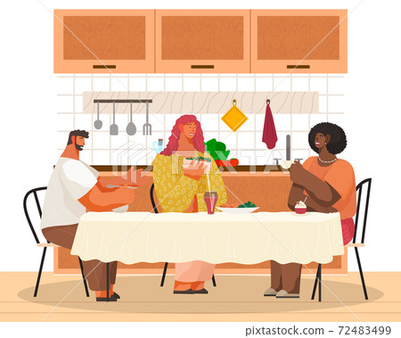 Smiling friends eating at home in the kitchen room interior together. Male and female communicating Smiling friends eating at home in the kitchen room interior together. Male and female communicating 72483499