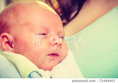 Little newborn baby sleeping calmly in blanket 72484401