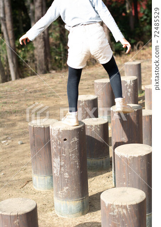 A child playing in the park A child playing in the park 72485529