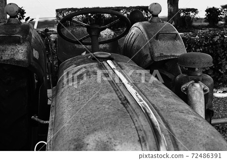 Decayed and shabby old farm equipment 72486391