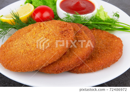 Fish pancakes on plate 72486972