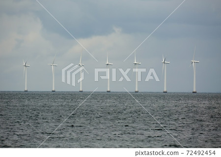 Wind tubines near the coast Wind tubines near the coast 72492454