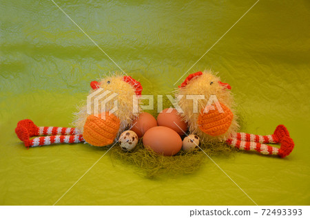 Easter scene with chick and eggs against yellow background Easter scene with chick and eggs against yellow background 72493393