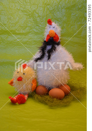 Easter scene with chicken with eggs and  chick    against yellow background 72493395