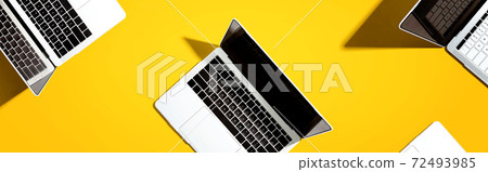Many Laptop computers with shadow 72493985