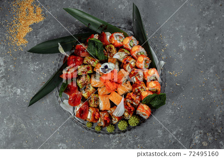 Sushi rolls set on a crystal tray. Rolls: Philadelphia, Green Dragon, Hawaii, Red Dragon, Ebi Shake Sushi rolls set on a crystal tray. Rolls: Philadelphia, Green Dragon, Hawaii, Red Dragon, Ebi Shake 72495160