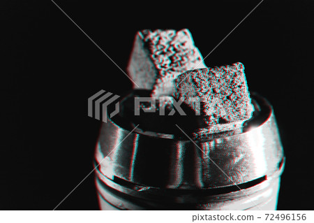 Coals in a hookah bowl close up 72496156