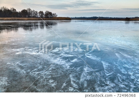 Frozen lake ice surface 72496368