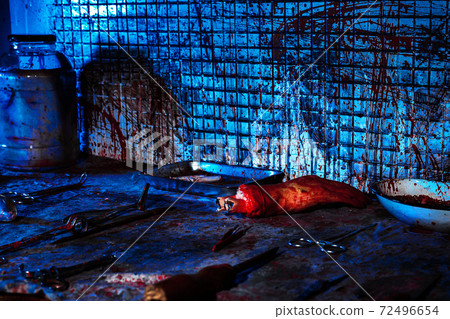 Human limbs and remains are covered in blood. Creepy and gloomy room for medical experiments 72496654