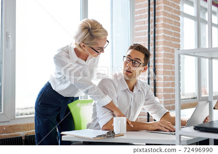 subordinate relations. nice unpleasant adult woman showing her sexual interest to employee 72496990