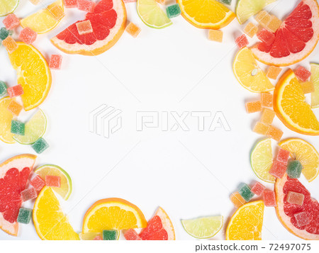 Frame of fruits and marmalade jelly candies on white 72497075