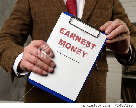 The clerk in the room introduces the earnest money documents. 72497189