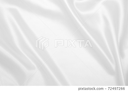 Smooth elegant white silk or satin luxury cloth texture as wedding background. Luxurious background design Smooth elegant white silk or satin luxury cloth texture as wedding background. Luxurious background design 72497266
