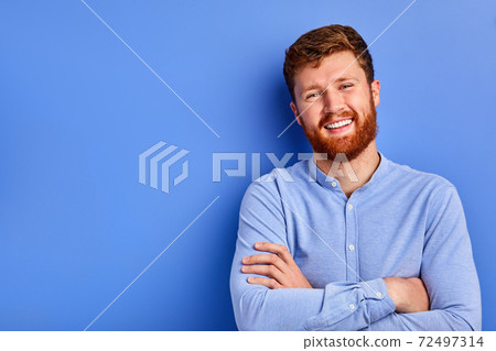 cheerful caucasian guy in blue stylish shirt smiles at camera isolated cheerful caucasian guy in blue stylish shirt smiles at camera isolated 72497314