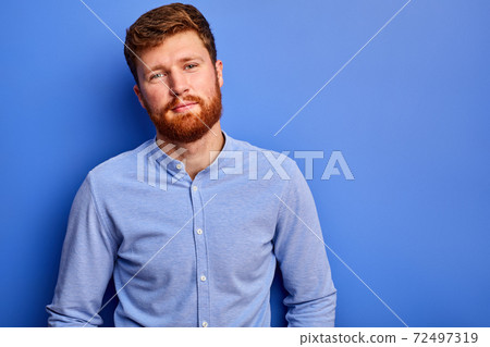 young man in shirt posing at camera isolated young man in shirt posing at camera isolated 72497319
