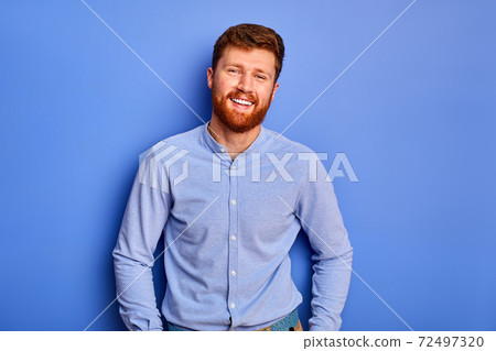 cheerful funny manager man smiling at camera isolated cheerful funny manager man smiling at camera isolated 72497320