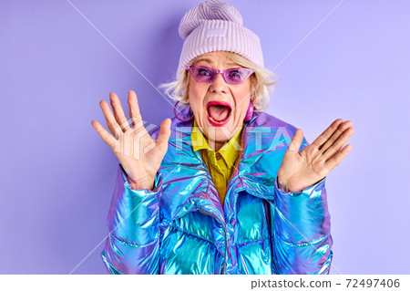 happy excited senior woman is screaming happy excited senior woman is screaming 72497406