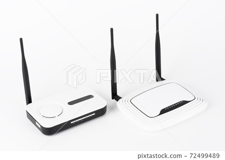 Two wifi routers, wireless devices with one and two antennas on white background. 72499489